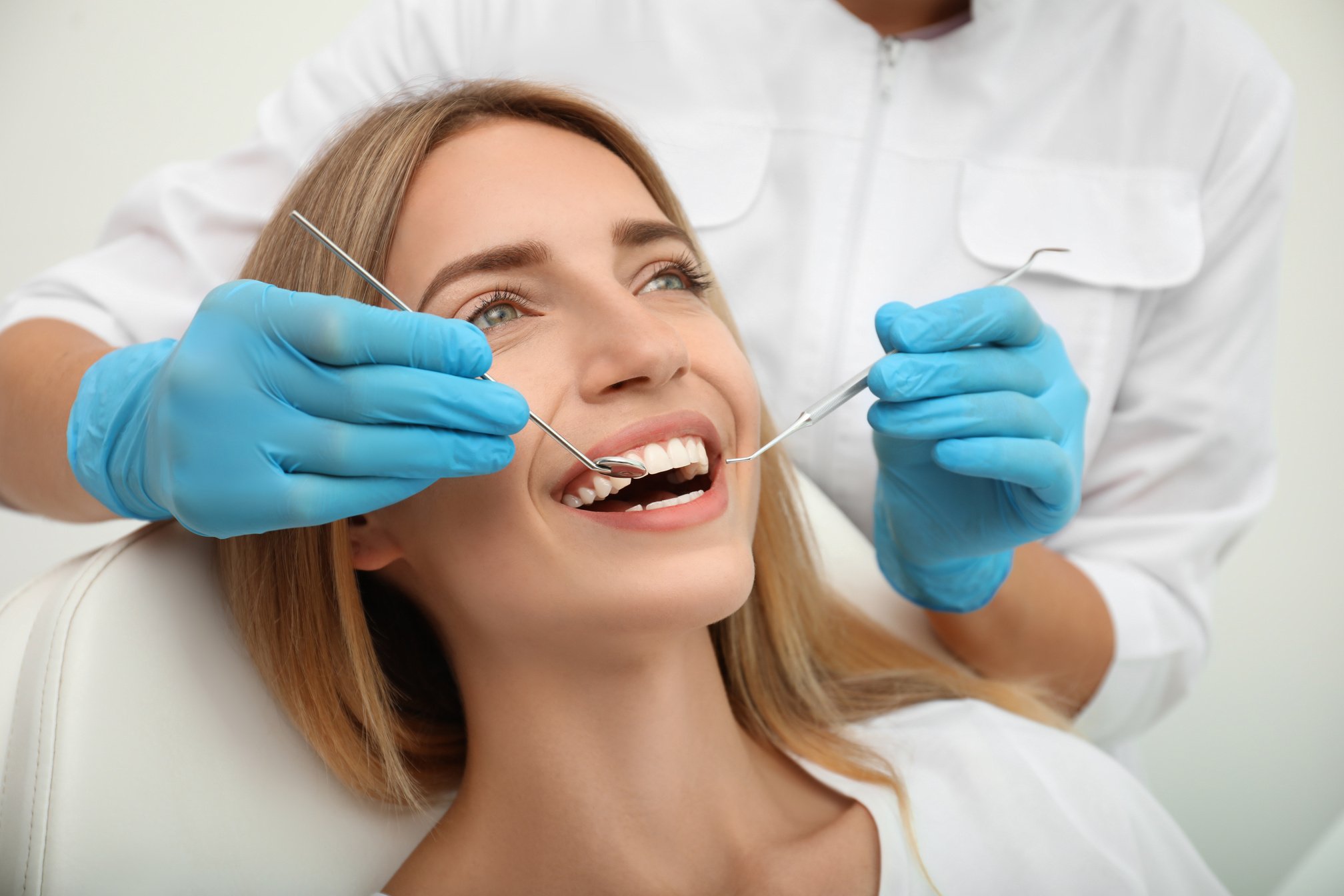 Doctor Examining Patient's Teeth, Closeup. Cosmetic Dentistry